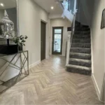 Detailed herringbone floor texture.