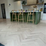 Dark modern herringbone floor.
