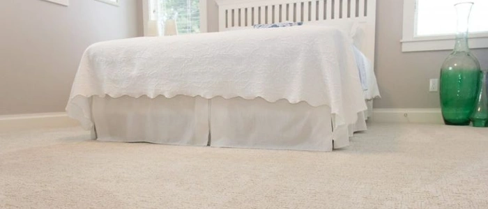 Soft plush carpet in light beige bedroom