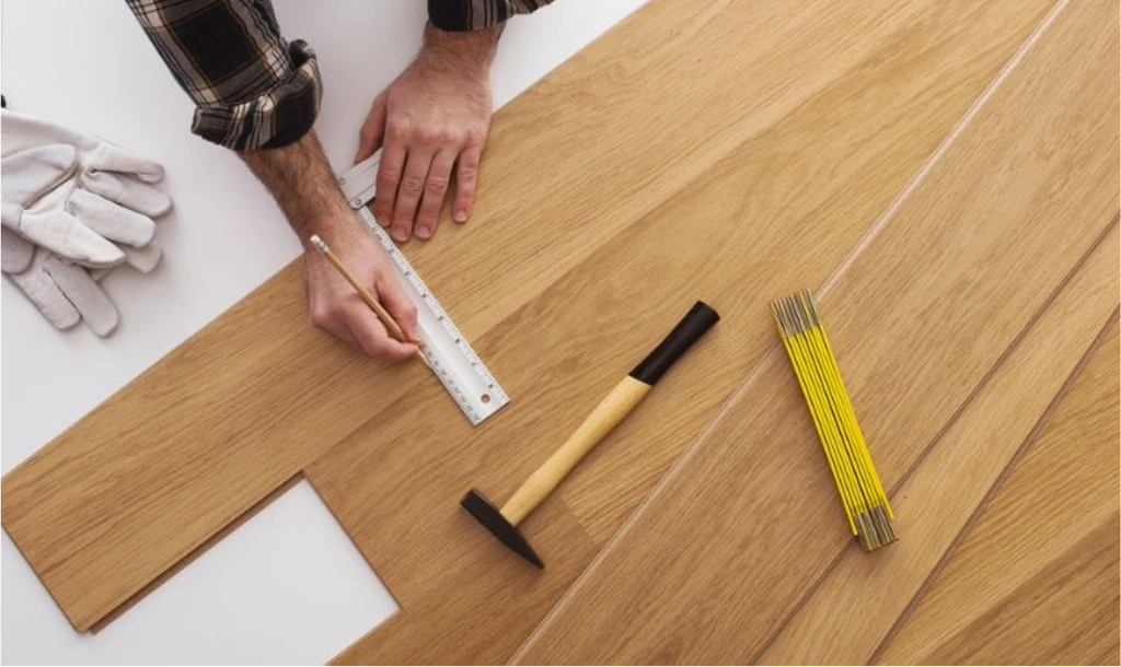 Expert installing vinyl click flooring in Dubai home
