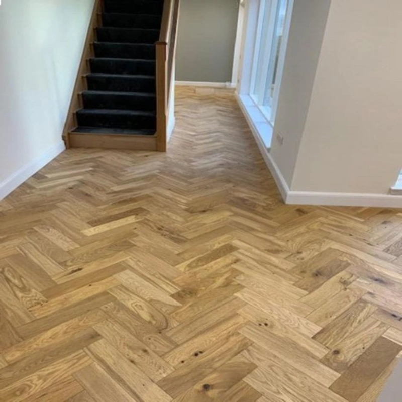 Natural wood herringbone flooring in Dubai living room
